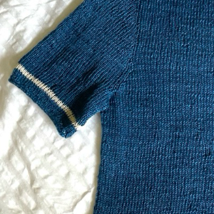 cropped image of a knit navy shirt